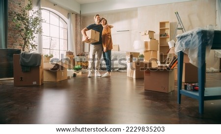 Family New Home Moving in: Happy and Excited Young Couple Enter Newly Purchased Apartment. Beautiful Family Happily Embracing. Modern Home Ready for Decorations. Mortgage Loan, Investment Concept Foto stock © 