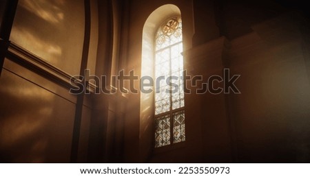 The Sun's Rays Streaming Through Stained Glass Windows of The Cathedral, Blessing The Church With A Heavenly Light that Enters House Of The Lord. A Reminder Of God's Love And Grace. Cinematic Concept 商業照片 © 