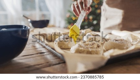 Similar – Image, Stock Photo Anonymous female cook rolling dough while using pasta machine