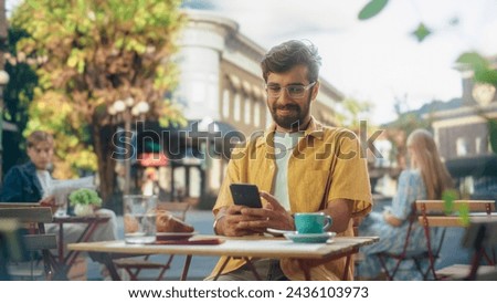 Similar – Image, Stock Photo Young man using mobile phone while walking outdoors