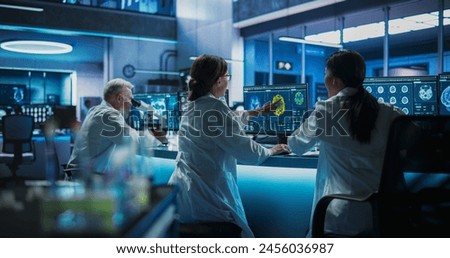 Similar – Image, Stock Photo Scientist working in the corona virus vaccine development laboratory research with a highest degree of protection gear.