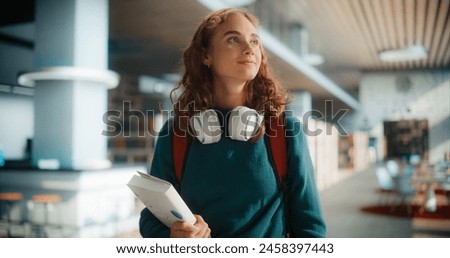 Similar – Image, Stock Photo Young female student in a university library