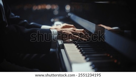 Similar – Image, Stock Photo Anonymous black man playing synthesizer while female watching in recording studio