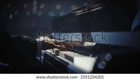 Similar – Image, Stock Photo Anonymous black man playing synthesizer while female watching in recording studio