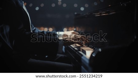 Similar – Image, Stock Photo Anonymous black man playing synthesizer while female watching in recording studio