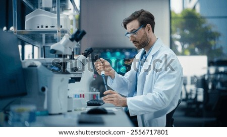 Image, Stock Photo Scientist working in the corona virus vaccine development laboratory research with a highest degree of protection gear.