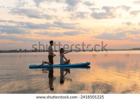 Similar – Image, Stock Photo Serene woman on surfboard in sea