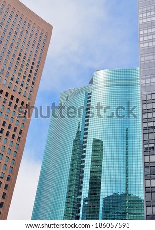 Tokyo JAPAN - March 10, 2014: Skyscrapers in Tokyo Japan with blue sky background.