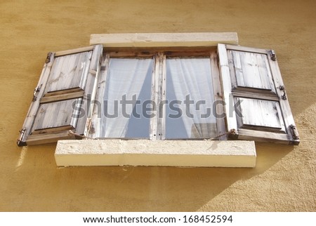 Vintage Wooden window shutters - opened old shuttered weathered