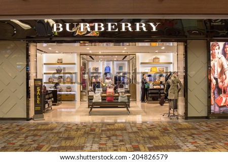 SINGAPORE - JUNE 20: Burberry store in Changi Airport, Singapore on June 20, 2014. It is a British luxury fashion house, distributing clothing, fashion accessories, fragrances and cosmetics.