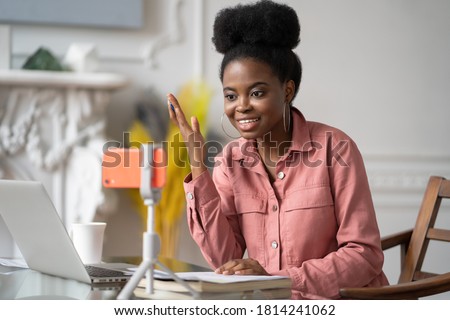 Similar – Image, Stock Photo Black woman recording video for social media
