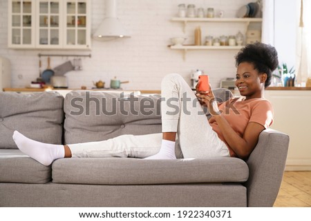 Similar – Image, Stock Photo Lying smiling woman with petals on face