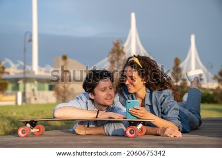 Similar – Image, Stock Photo Carefree male skater browsing cellphone in city