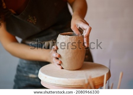 Similar – Image, Stock Photo Crop woman sculpturing pot with clay