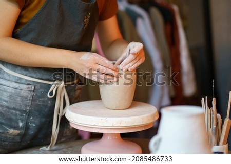 Similar – Image, Stock Photo Crop woman sculpturing pot with clay