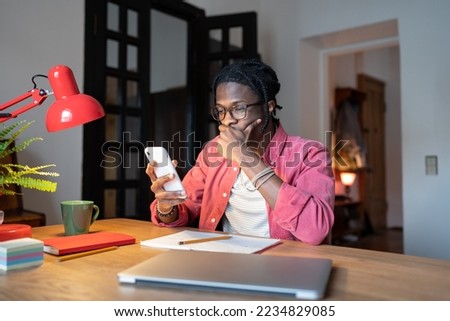 Similar – Image, Stock Photo Focused man using smartphone on rooftop