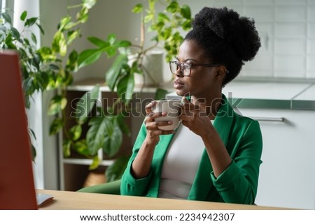 Similar – Image, Stock Photo Pensive woman drinking coffee and browsing smartphone at table