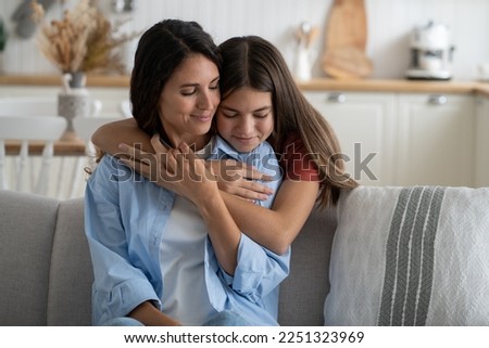 Similar – Image, Stock Photo Mother and young child at beach playing with water