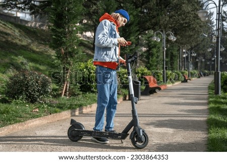 Similar – Image, Stock Photo Activating electric scooter from smartphone