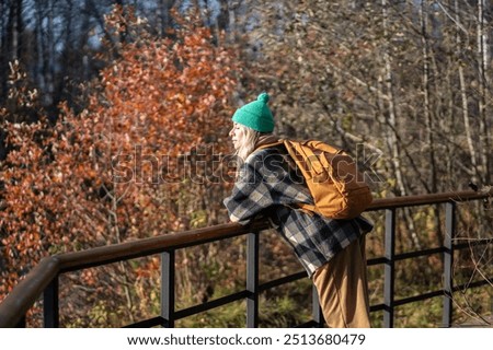 Similar – Image, Stock Photo Adventurer leaning on the door of an off-road car