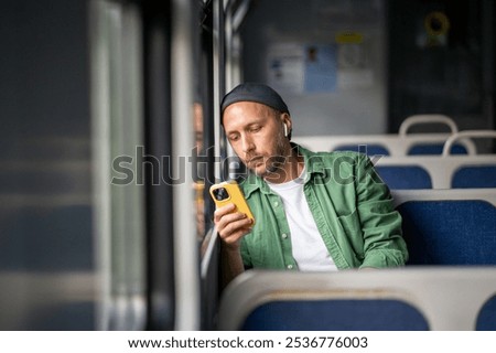 Similar – Image, Stock Photo Concentrated male passenger using laptop in train