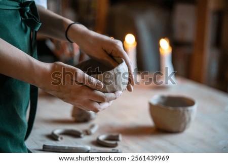 Similar – Image, Stock Photo Crop woman sculpturing pot with clay