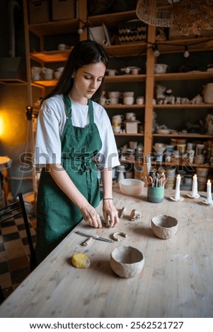 Similar – Image, Stock Photo Female ceramist making clay bowl in studio