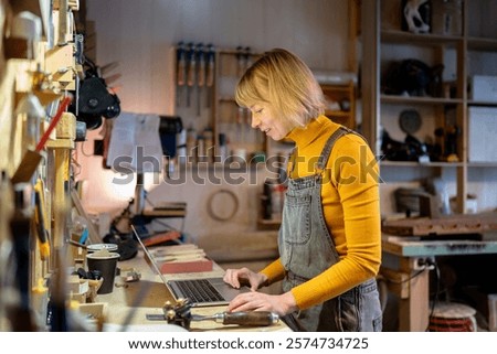 Similar – Image, Stock Photo Female artisan working with paints in workshop