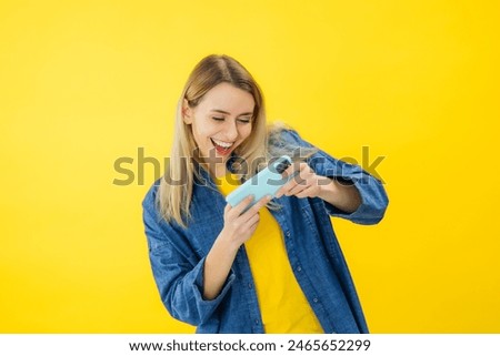 Similar – Image, Stock Photo Concentrated and enthusiastic girl plays table hockey.