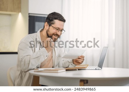 Similar – Image, Stock Photo Happy man reading message on smartphone