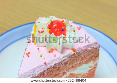 slice of Victoria sponge cake on plate background