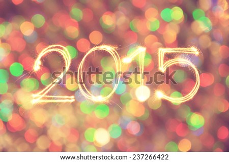 New Year 2015 writing with Defocused light blur bokeh background in Vintage tone
