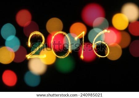 New year 2016 writing sparkles firework with dirty defocused light blur bokeh background