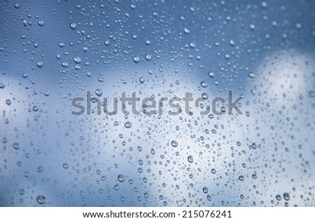 Beautiful raindrop background against cloudy blue sky background