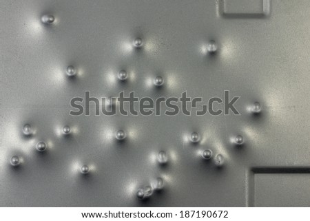 dents of bullets on a metal surface background
