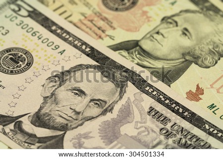 Denominations five and ten dollars abstract background