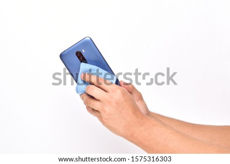 Similar – Image, Stock Photo Hand cleaning a phone screen with wet antibacterial wipes to avoid virus contamination.