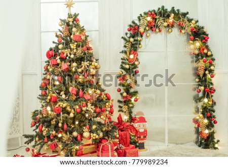 new years tree and the arch are decorated in classic red gold color background decorations - Christmas Arch Decorations new years tree and the arch are decorated in classic red gold color background decorations - Christmas Arch Decorations