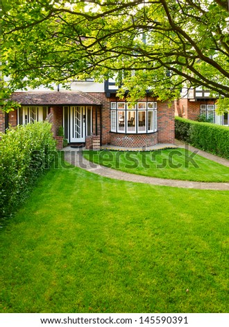 Front lawn of a brick house in England