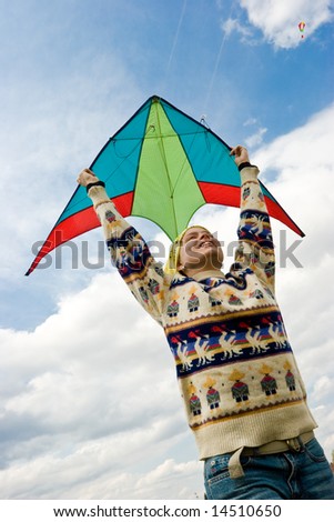 Young woman flying kite