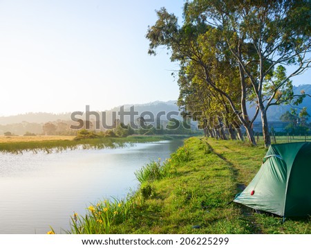 Riverside campsite in a morning light