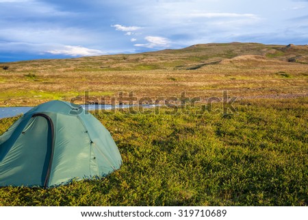 Camping tent on a river shore in Iceland