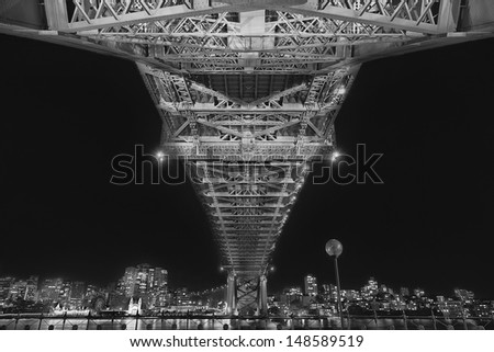 Under the Sydney Harbour Bridge at night (black and white)