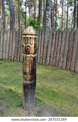RUSSIA-KEMEROVO,AUGUST 3, 2014:Ruevit - God of war Baltic Slavs,wooden sculpture. Museum-reserve \