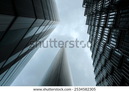 Similar – Image, Stock Photo Gloomy skyscraper facade with graphically cut hedge plant