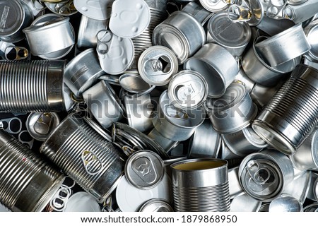 Large amount of metal tins, cans and jars for recycling. Aluminum metal food and drink sorted scraps. Steel packaging. Zero waste and recycle of domestic waste at home concept. No pollution.