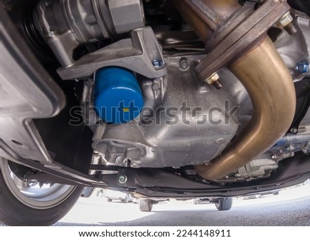 Car bottom view, part of catalytic converter in automobile exhaust system. Engine oil filter and pan. Transmission pan. Pre purchase inspection or pre delivery check up. Auto mechanic view. Imagine de stoc © 