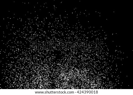 Falling snow or night sky with stars pattern. Black and white hand drawn blow spray or splash monochrome sparkle texture. White spots or stars on dark sky at night.  Abstract falling snow backdrop.