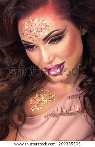 Fashion Art Beauty Portrait. Beautiful woman with amazing fantasy creative make up