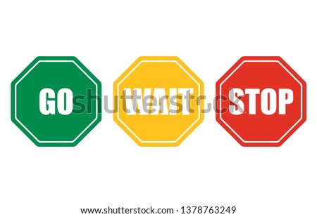 Go, wait, stop set signs. Octagonal green go, red stop, yellow wait. Traffic regulatory warning symbols.
